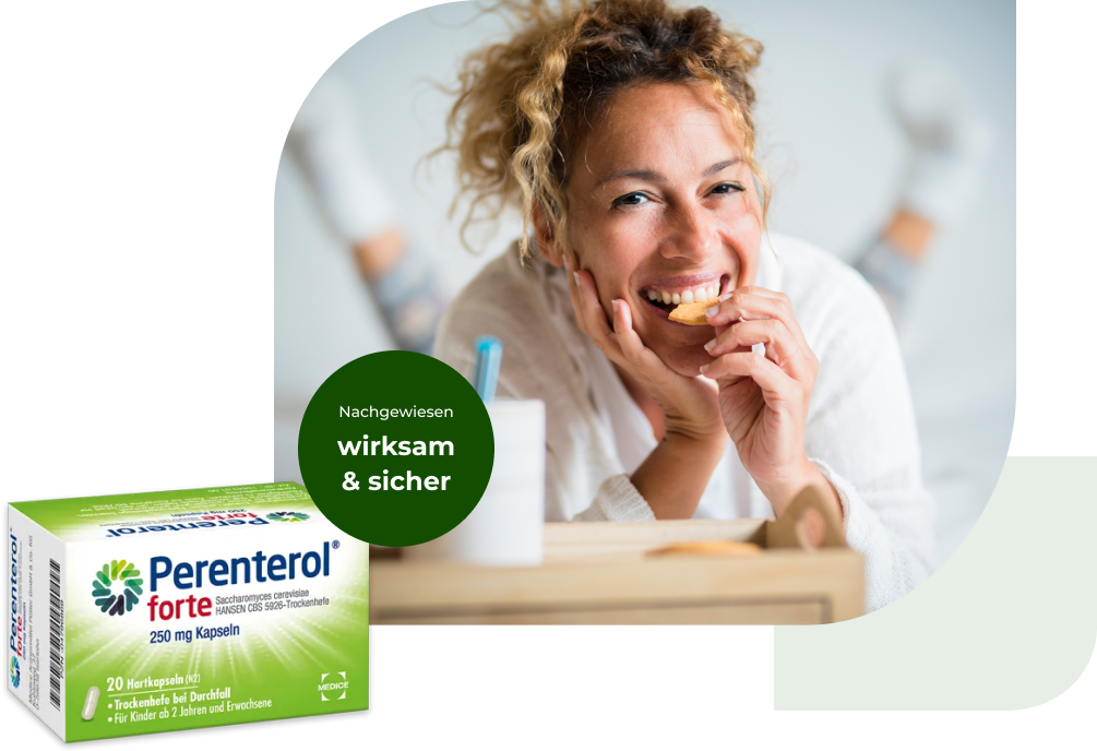 Eine Perenterol forte Verpackung, mit einer Frau, die in einen Keks beißt im Hintergrund. Anbei steht der Hinweis, dass Perenterol nachgewiesen wirksam und sicher ist